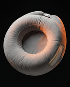 Angled view of the donut-shaped lap pillow showing its cradling center hole