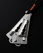 Macro of the brushed metal over-door anchor bracket and cord