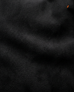Macro of the soft brushed microfiber fabric covering the travel footrest