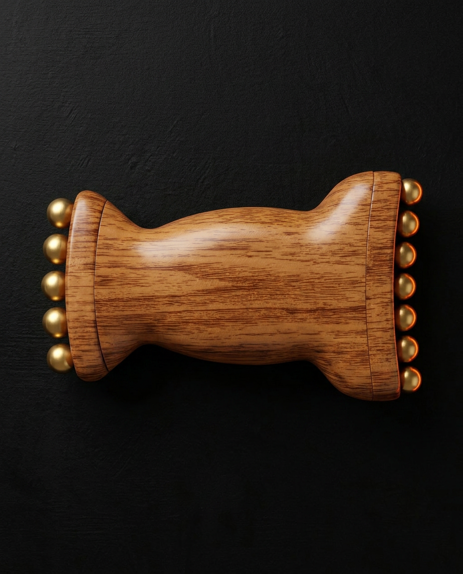 Top-down view of the wooden roller flat, brass beads lining both rolling ends