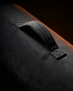 Close-up of the reinforced carry handle stitched on the velvet bolster