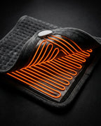 Heating pad opened to reveal glowing orange carbon-fiber heat channels