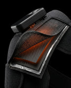 Cutaway showing the glowing carbon-fiber heating element inside the shoulder wrap