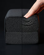 Hand pressing the seat cushion showing slow-rebound memory foam compression