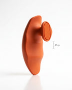 Side profile of orange grip pad showing 3.7 cm ergonomic palm curve