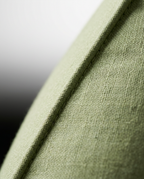 Close-up of the piped edge seam on the green reading backrest cushion