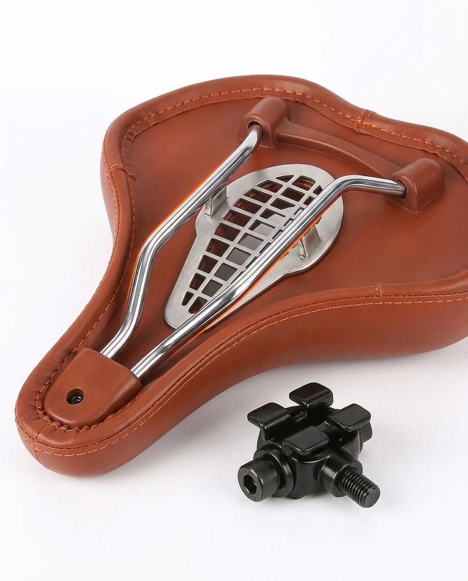 Underside of the brown saddle showing chrome steel rails and seatpost clamp