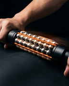 Hands spinning the roller mid-use showing the 360-degree steel ball rotation