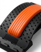 Macro of the padded ribbed orange spine cushion on the arched back stretcher