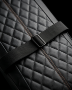Macro of the adjustable strap buckle and diamond quilting on the massage cushion