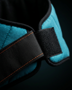 Macro of the Velcro strap closure with orange stitching on the neck wrap