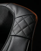 Macro of the quilted faux-leather and mesh material on the massager