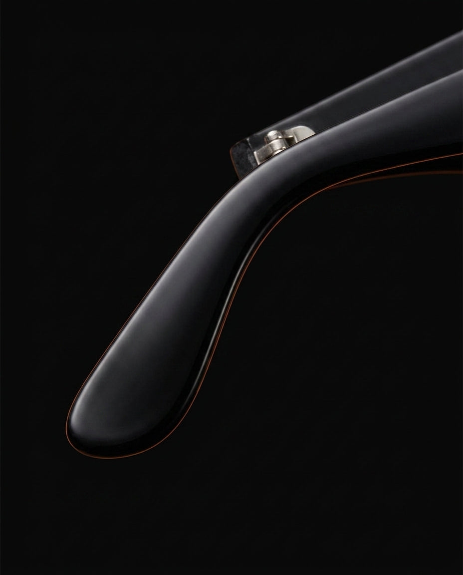 Close-up of the glossy black tapered temple arm of the blue light glasses