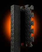 Cross-section macro showing the thickness of the black EVA foam mat tile