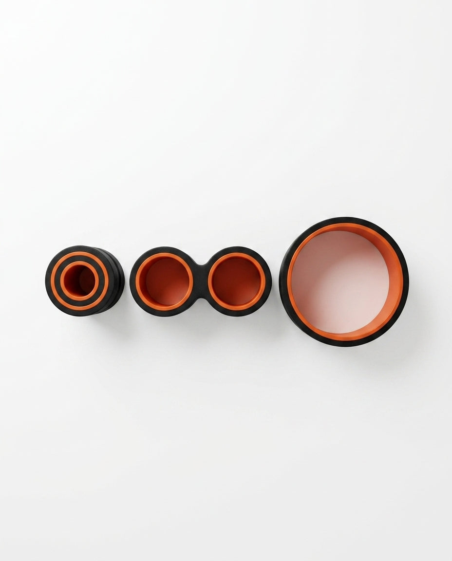 Three back rollers in small, medium and large sizes lined up on white