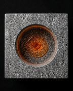 Overhead view of the circular oil recess in the granite cube holder