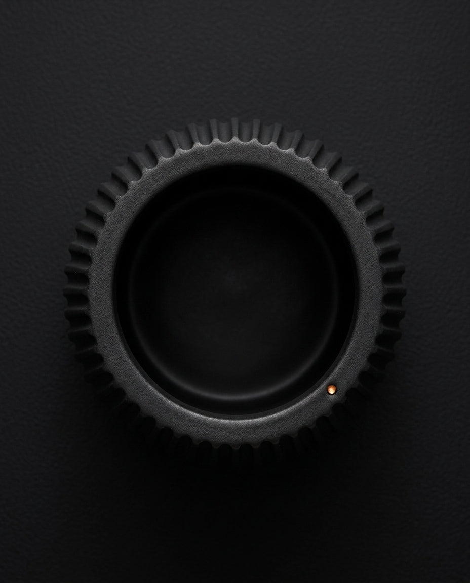 Top-down view into the ribbed black holder cup opening