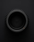 Top-down view into the ribbed black holder cup opening