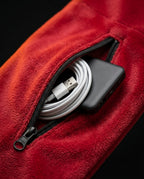 Heated scarf zip pocket holding a power bank and USB charging cable