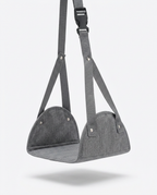 Grey portable foot hammock with straps and buckle, studio on white