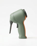 Sage green cordless cleaning tool with nozzle, side view on white