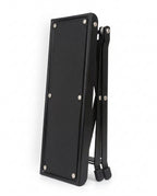 Black footrest platform folded flat for compact storage, on white