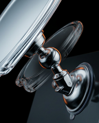 Macro of the shower mirror's adjustable ball-joint swivel behind the suction mount
