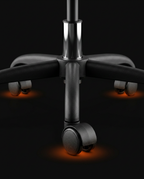 Macro of the office chair's five-star base with rolling casters and gas lift