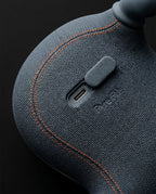 Macro of the woven fabric back with USB-C port and contrast stitching