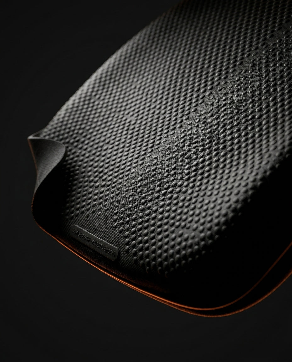 Close-up of the dotted non-slip rubber base on the memory foam seat cushion