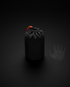 Travel pillow packed into its compact black drawstring stuff bag