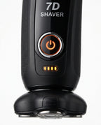 Macro of the lit orange power button and battery bars on the 7D shaver handle