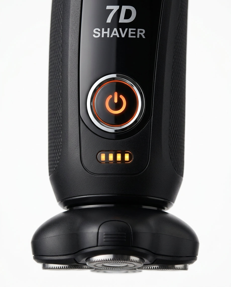 Macro of the lit orange power button and battery bars on the 7D shaver handle