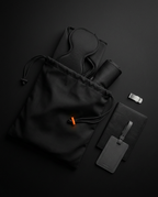 Travel rest set packed beside its black drawstring storage pouch and tag