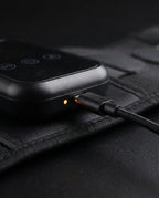 Close-up of the waist massager controller charging via USB-C cable