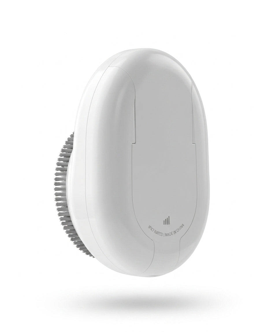 Side view of the handheld white electric shower scrubber showing its grip body
