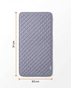 Size guide showing the gray quilted heating pad at 63 by 31 centimeters
