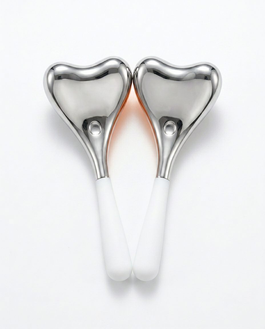 Heart-design variant: pair of heart-head steel eye massagers with white handles
