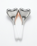 Heart-design variant: pair of heart-head steel eye massagers with white handles