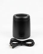 Black wax warmer with US plug power cord on a white background