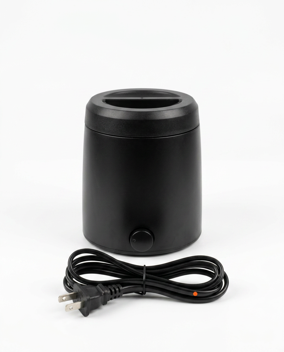 Black wax warmer with US plug power cord on a white background