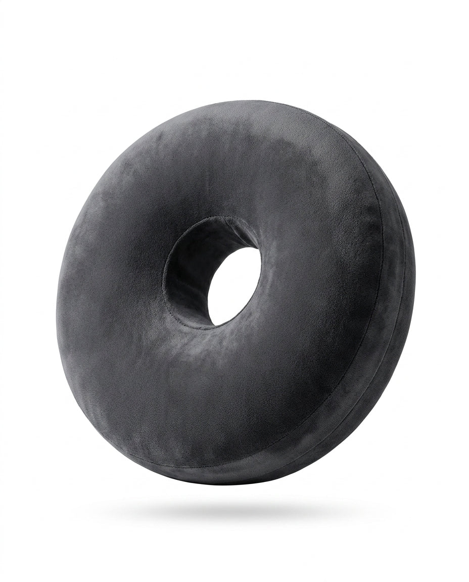 Charcoal grey ring lap support pillow standing upright on white background