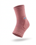 Pink cooling compression ankle sleeve with gel pocket, studio shot on white