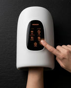 Top-down hand inside the massager, finger tapping the lit control panel