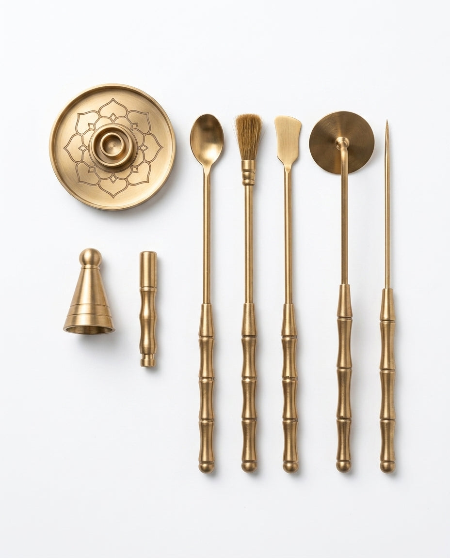 Overhead flat lay of the full brass incense kit contents on white