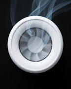 Top-down view of the purifier's circular fan outlet with clean air swirling out