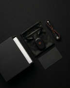 Posture corrector unboxing flat lay with pouch and USB-C cable