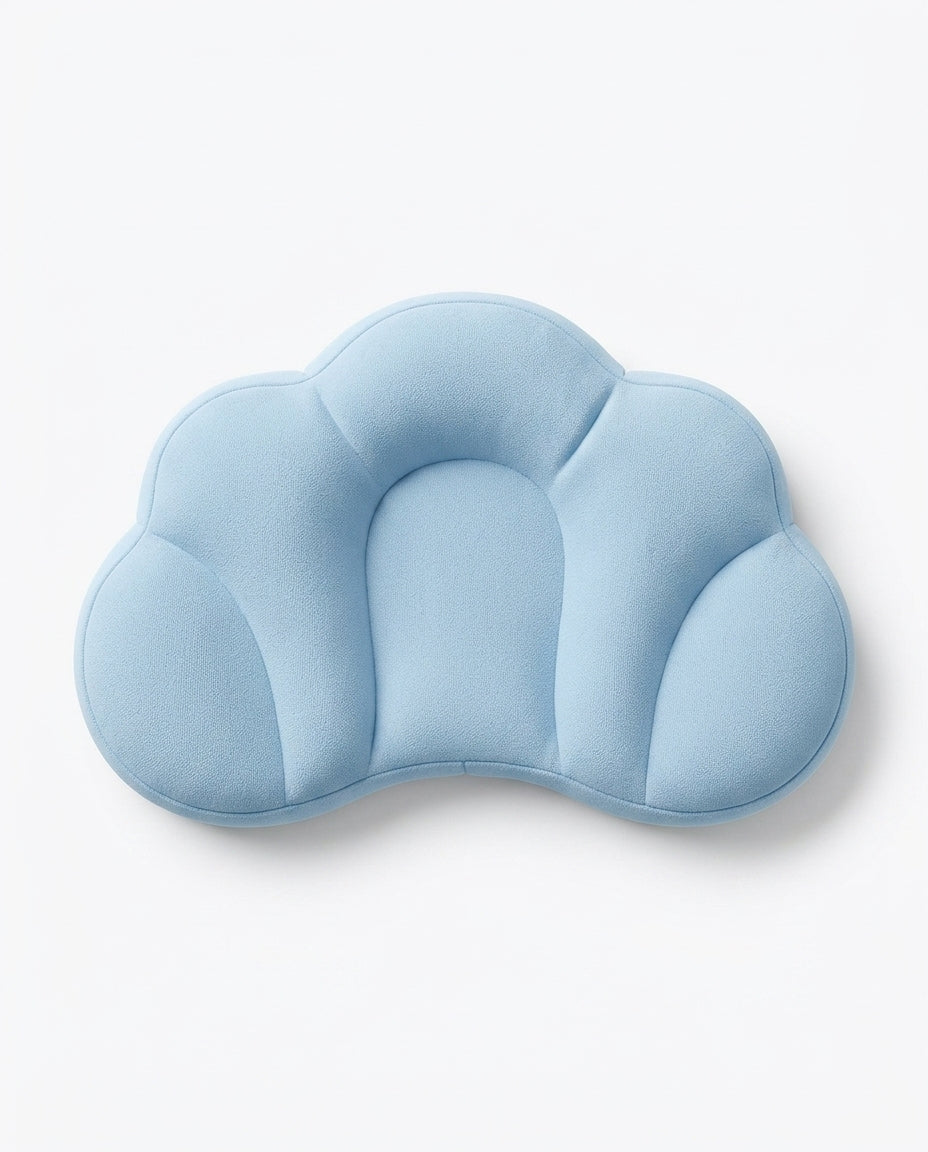 Top view of the blue cloud-shaped contour pillow with central head cradle