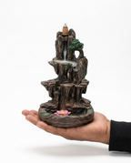 Backflow incense holder held in an open palm to show its size