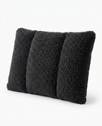 Black sherpa lumbar support pillow with quilted channels on white